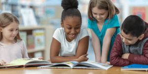 Children looking at a book.