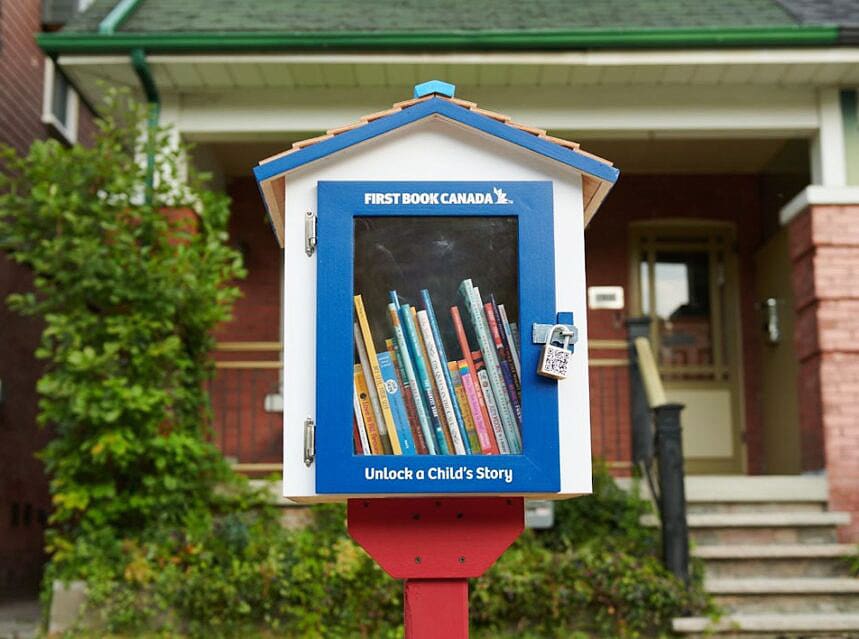 A wooden locked box housing books.